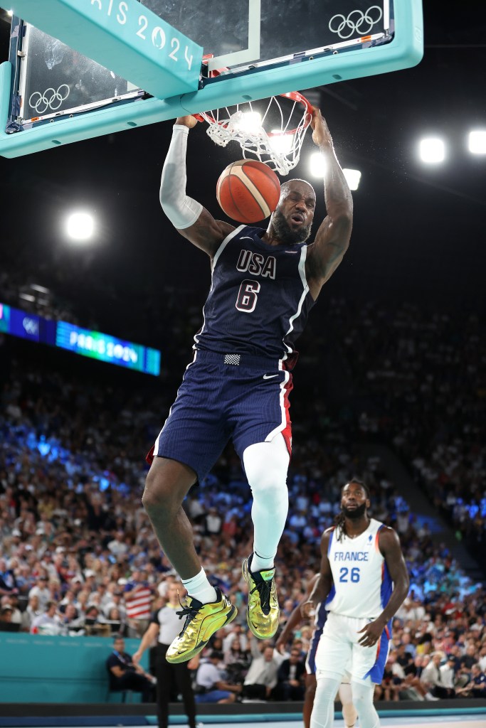 LeBron James dunks the ball during the men's Gold Medal game between Team France and Team United States at Bercy Arena on August 10, 2024 in Paris, France.