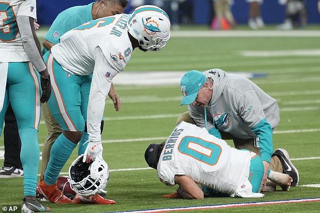 Miami Dolphins wide receiver Braxton Berrios (0) is checked on after hurting his knee