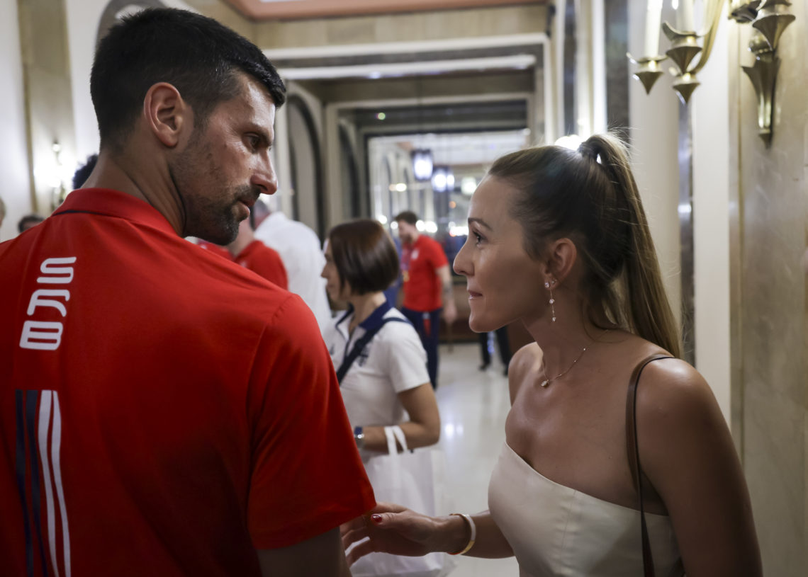 Novak Djokovic (L) speaks with his wife Jelena Djokovic (R) during Celebration Of Serbia Olympic Team at City hall on August 12, 2024 in Belgrade,...