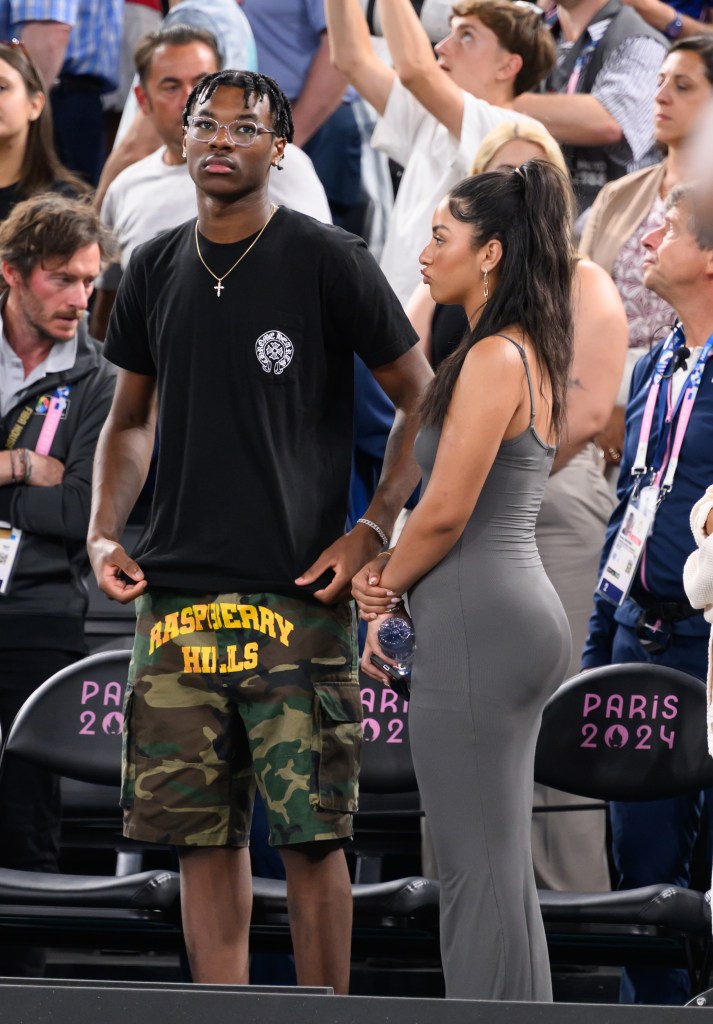 Bryce James and Sadie Johnson at the men's basketball semifinals game between Team USA and Team Serbia at Bercy Arena on August 8, 2024 in Paris, France.