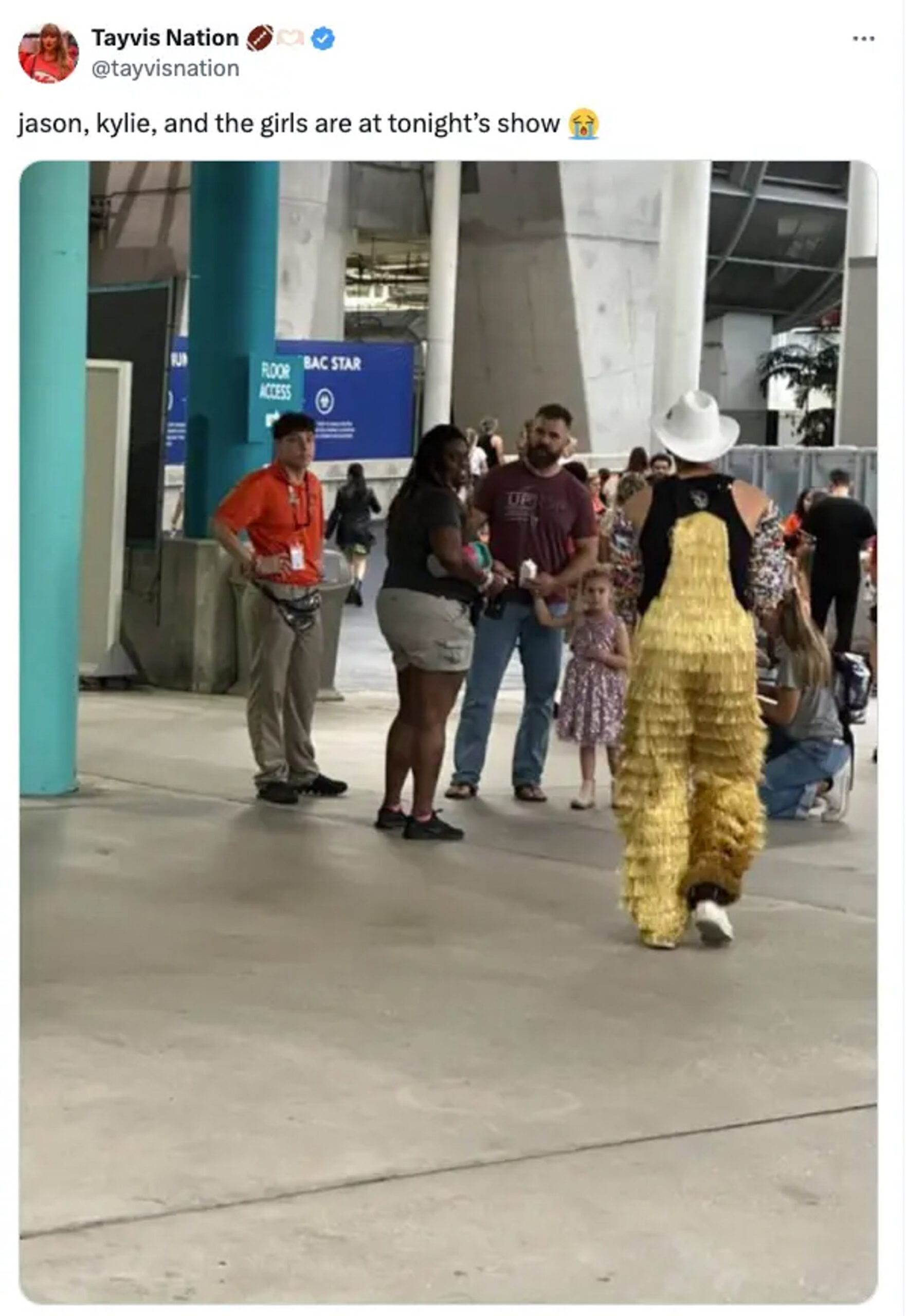 Jason Kelce and Kylie Kelce with their daughters at a Eras Tour show.