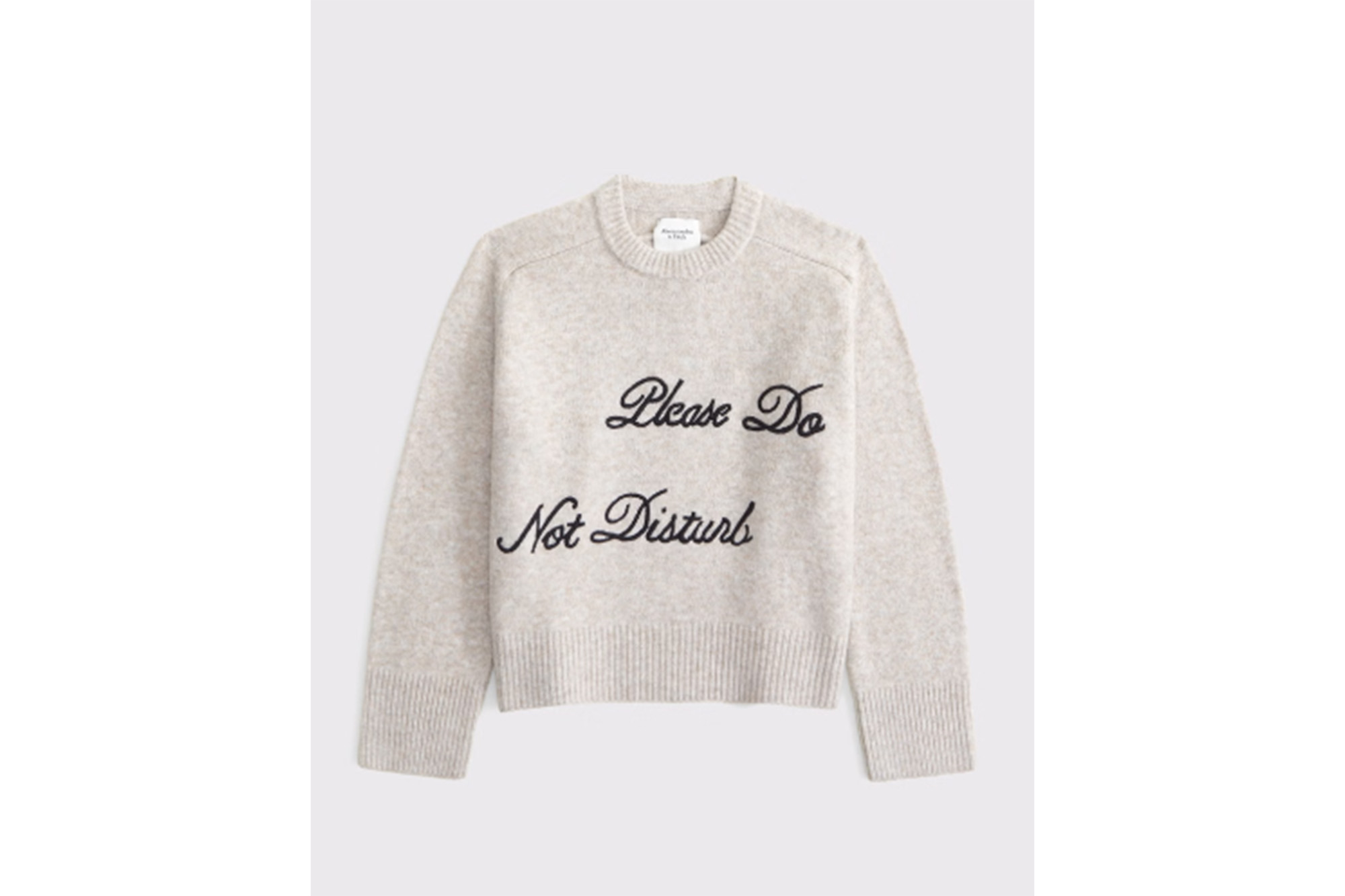 A sweater that says "Please do not disturb" on it