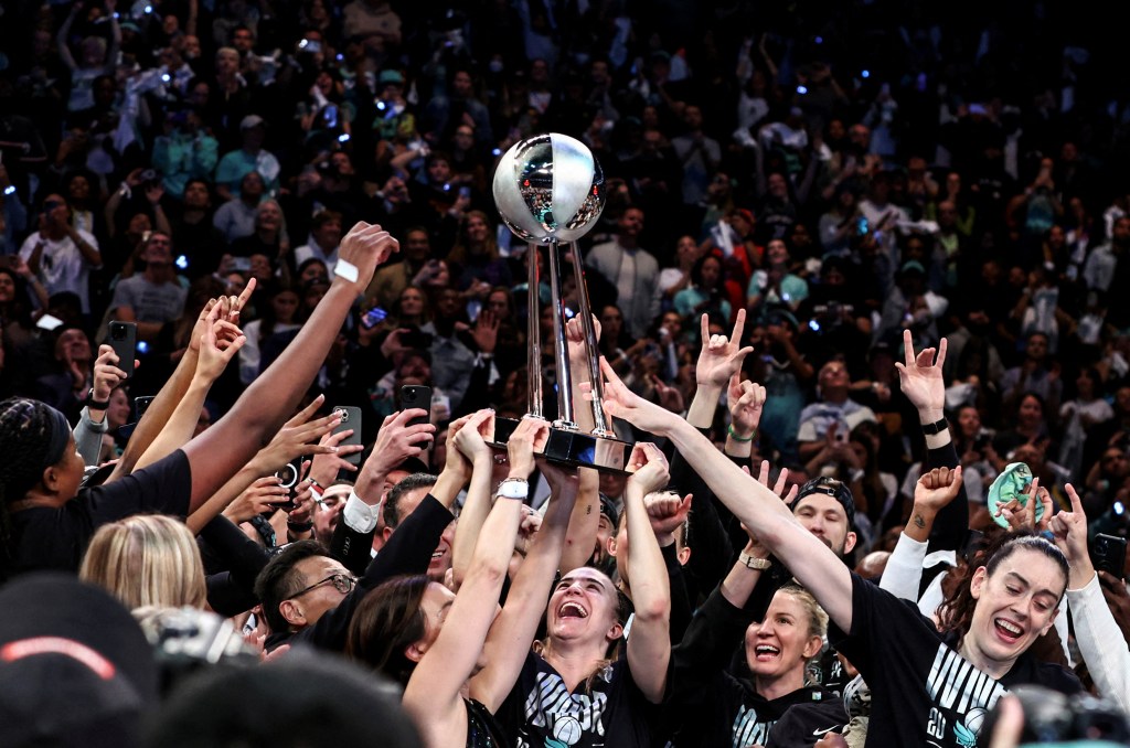 The Liberty celebrate after defeating the Lynx in Game 5 of the WNBA Finals to win their first WNBA title at Barclays Center on Oct. 21, 2024.