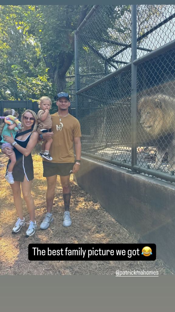 Brittany and Patrick Mahomes with Sterling and Bronze posing in front of a lion at the zoo in an Instagram posted Oct. 10.