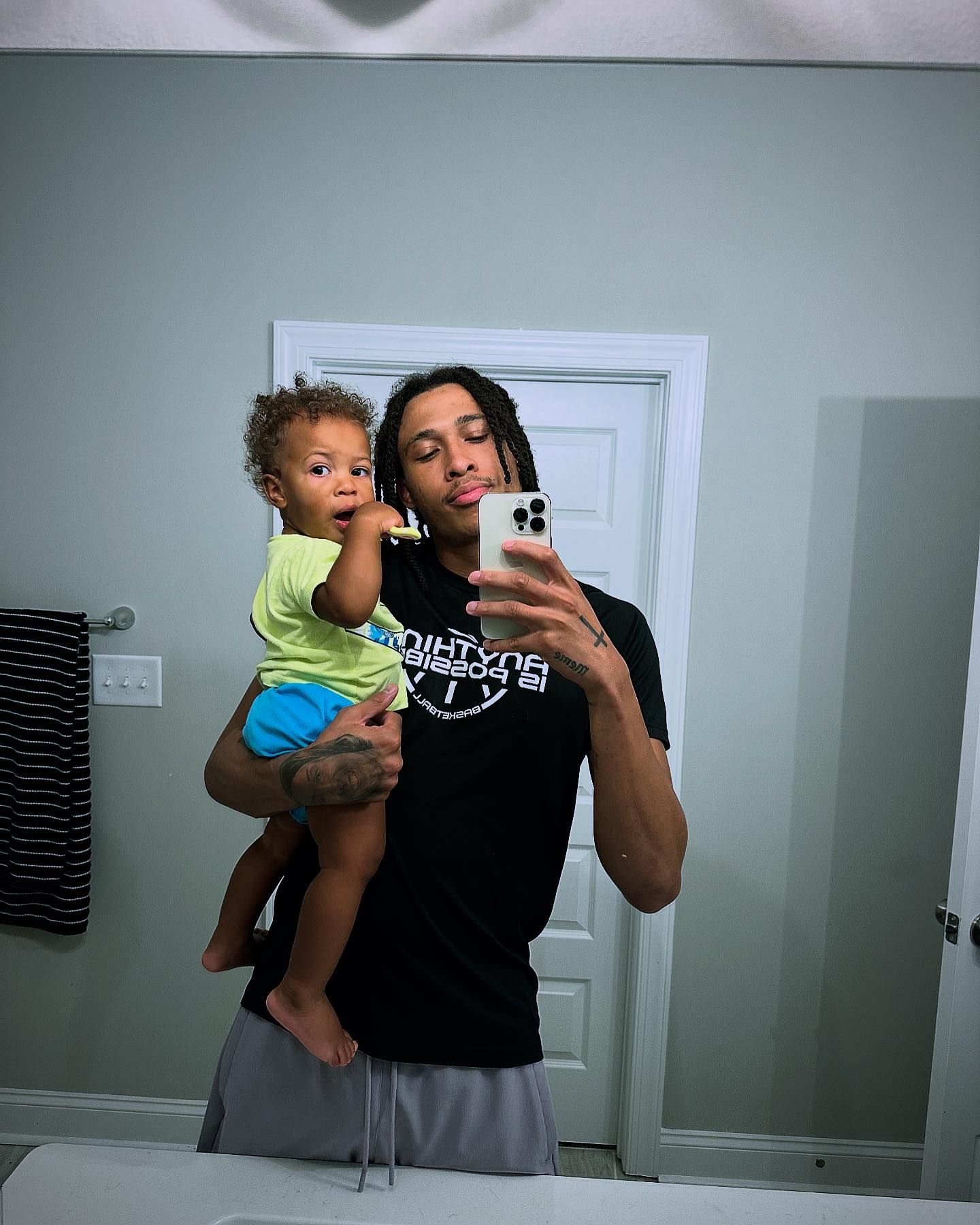 A mirror selfie of R.J. Hampton and his son, Halo.