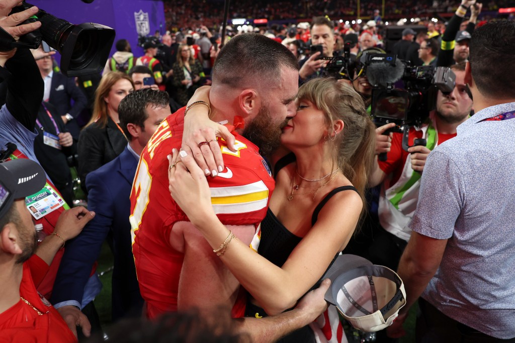 Travis Kelce #87 of the Kansas City Chiefs kisses Taylor Swift after defeating the San Francisco 49ers 25-22 in overtime during Super Bowl LVIII at Allegiant Stadium on February 11, 2024 in Las Vegas, Nevada.