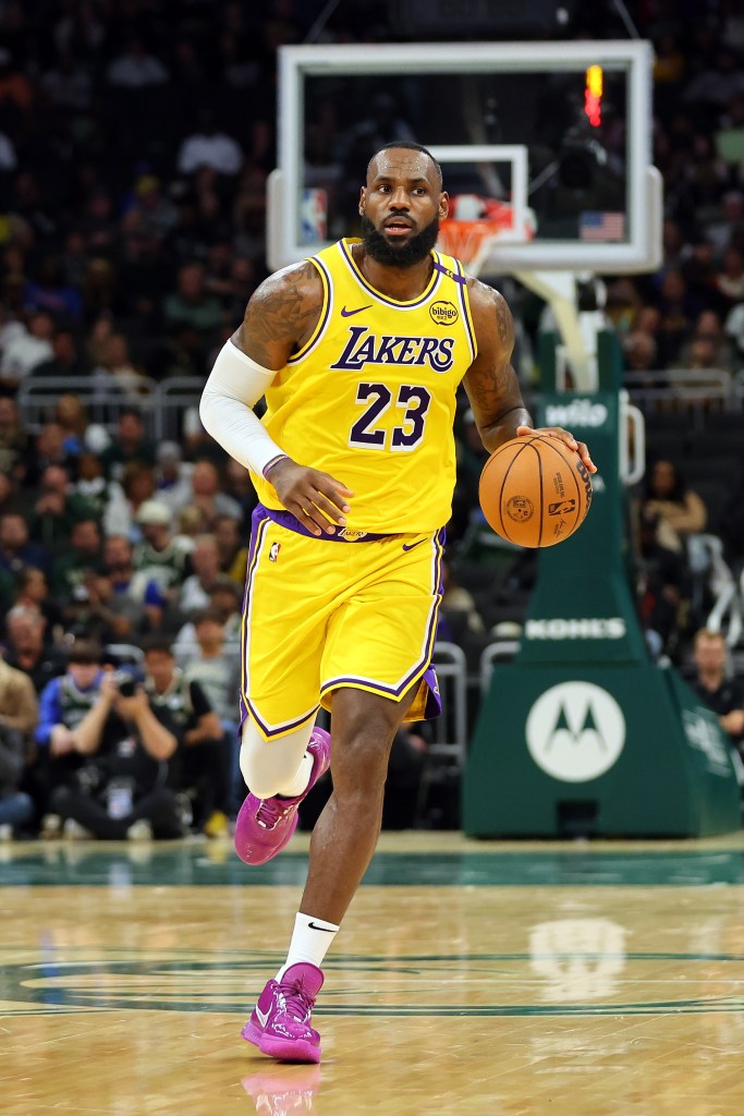 Lakers star LeBron James handles the ball during a preseason game against the Milwaukee Bucks at Fiserv Forum on October 10, 2024 in Milwaukee, Wisconsin.