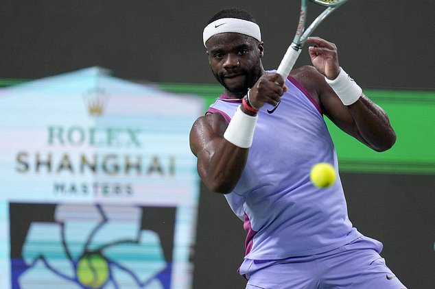 Frances Tiafoe of the United States returns a shot to Zhou Yi of China during the men's singles second round match in the Shanghai Masters tennis tournament at Qizhong Forest Sports City Tennis Center in Shanghai, China, Monday, Oct. 7, 2024. (AP Photo/Andy Wong)