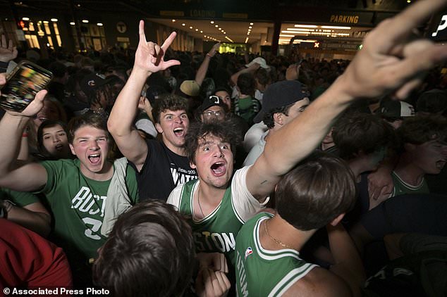 FILE - Boston Celtics fans react following the Celtics victory over the Dallas Mavericks in Game 5 of the NBA basketball finals in Boston on Monday, June 17, 2024. (AP Photo/Josh Reynolds, File)